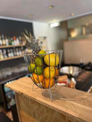 a basket of fruit on top of a table at ProfilHotels President in Norrköping