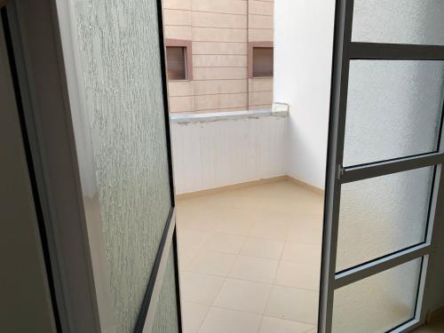 a glass door to a shower in a bathroom at العقارية in Beni Enzar