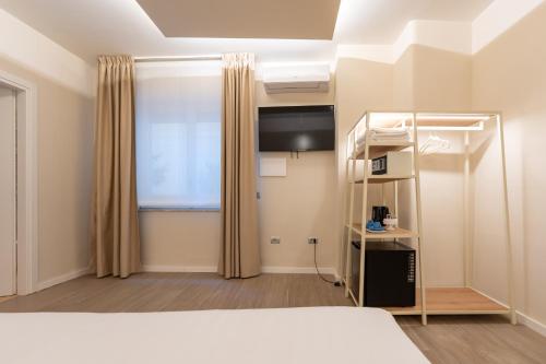Katil atau katil-katil dalam bilik di Six Luxury Rooms Pozzuoli