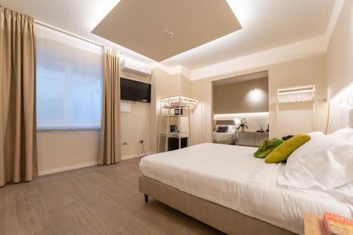 Katil atau katil-katil dalam bilik di Six Luxury Rooms Pozzuoli