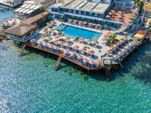 an aerial view of a resort in the water at Manolya Hotel in Kérynia