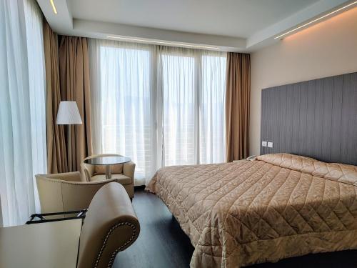 Posteľ alebo postele v izbe v ubytovaní Hotel Datini
