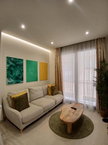a living room with a couch and a coffee table at Antika Marbella 1A in Marbella
