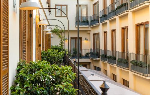 an apartment balcony in a building with plants at Ecole St. Pierre Hotel in Istanbul