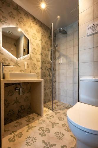 a bathroom with a toilet and a sink and a shower at Casa Rosanna Malta B&B Adults only 16 plus in Marsaskala