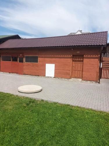 a building with a frisbee in front of it at Vila Pavlínka apartmány Losiny in Velké Losiny