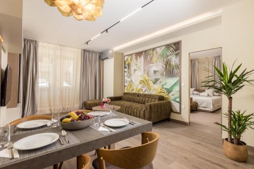 a living room with a table and a couch at Luxury Apartments Centre of Opatija in Opatija