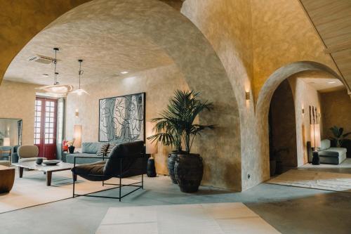 a living room with a couch and a table at The Farm - Azores Boutique House in Ponta Delgada
