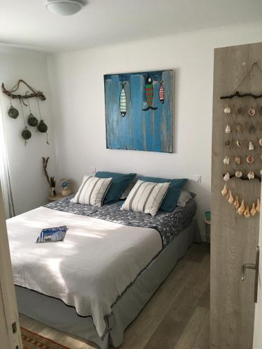 En eller flere senge i et værelse på Les Tamaris d'Audenge