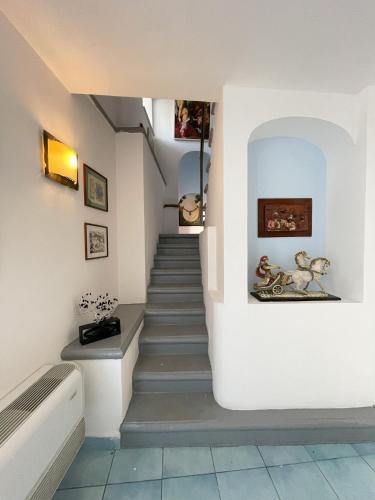 a staircase in a house with a stair case at Hotel Terme Zi Carmela in Ischia
