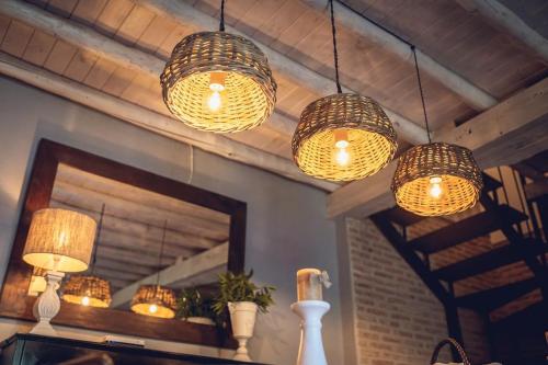 a group of lights hanging from a ceiling at La Casa del Jardín in Candeleda