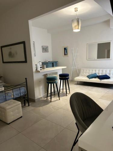 a living room with a couch and a table and chairs at Allegra Toscana - Affittacamere Guest house Arezzo in Arezzo