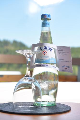 a bottle of water sitting on top of a table at Best Western Plus Hotel Alpenhof in Oberstdorf