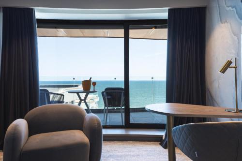 a hotel room with a view of the ocean at Crowne Plaza Constanta - Mamaia Beach by IHG in Mamaia