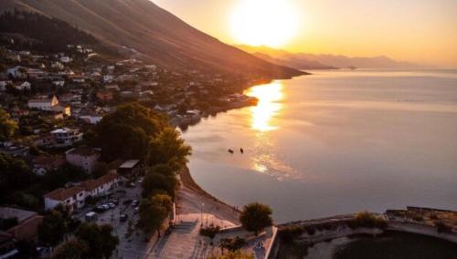 an aerial view of a beach at sunset at Aloha House in Shkodër