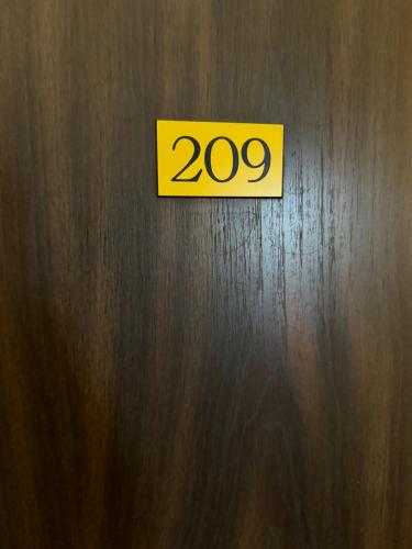 a door with a sign that says on it at Hôtel Bosquet Pau Centre - Self Check In Budget Hotel in Pau