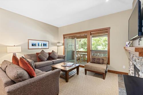 a living room with two couches and a fireplace at Horstman House by Whistler Premier in Whistler