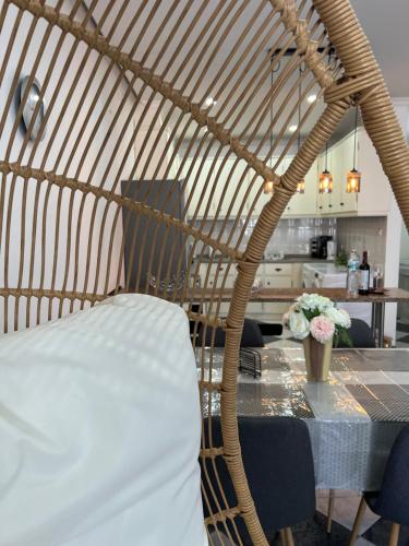 a dining room with a table with a white chair at Apartment in Biscoitos Terceira in Biscoitos