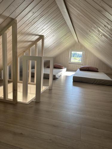 Una cama o camas en una habitación de Mežmalas atpūtas bāze