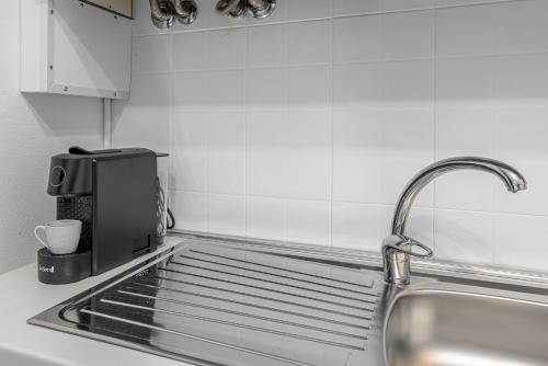 Kuchyň nebo kuchyňský kout v ubytování Gallarate Central Suite