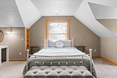 a bedroom with a bed in a attic at C Street Charm in Coeur d'Alene