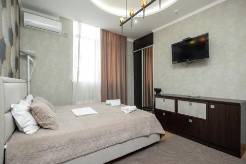 Postel nebo postele na pokoji v ubytování IRIS Hotel