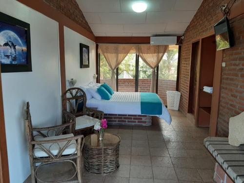 Postel nebo postele na pokoji v ubytování Suite Hotel Romanos