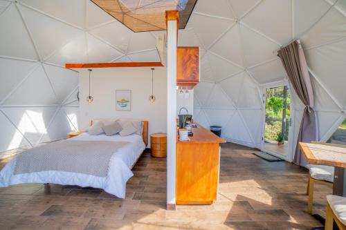 Postel nebo postele na pokoji v ubytování Tocuma Glamping