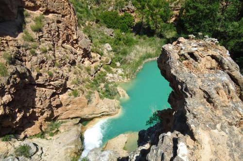 an aerial view of a pool of water in a canyon at Casas rurales de La Fuente in Villora