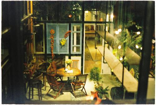 a view of a patio with a table and chairs at Trại Hoa Vàng Homestay at Phú Yên in Ðông Tác (1)
