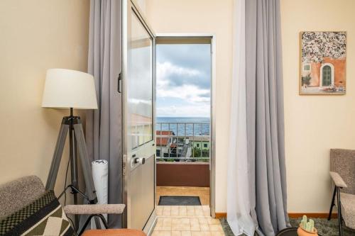 a room with a door leading to a balcony at Cobalt in Seixal