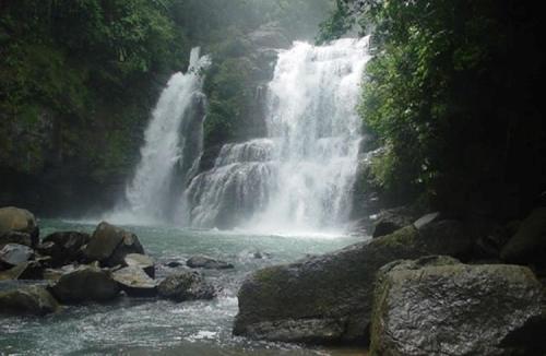 a waterfall in the middle of a river at The Wavefront Beachfront Condo In Bejuco in Bejuco