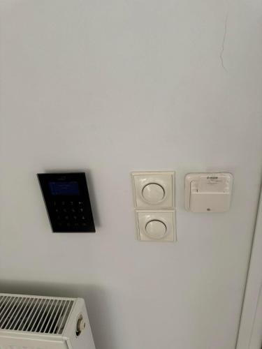 a corner of a room with a laptop on a wall at Blessed view in Keratea
