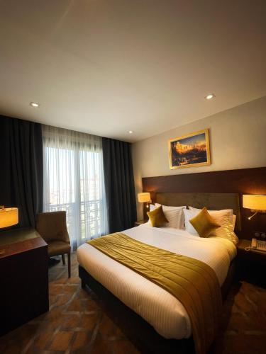 Voodi või voodid majutusasutuse LE PALME HOTEL toas