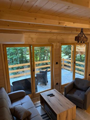 a living room with a couch and a coffee table at Ethno Village Long Story in Kolašin
