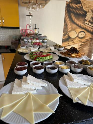 a buffet with plates of food on a table at deperlas in Atakum
