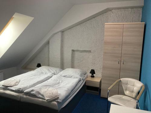 Postel nebo postele na pokoji v ubytování Penzion Grasel