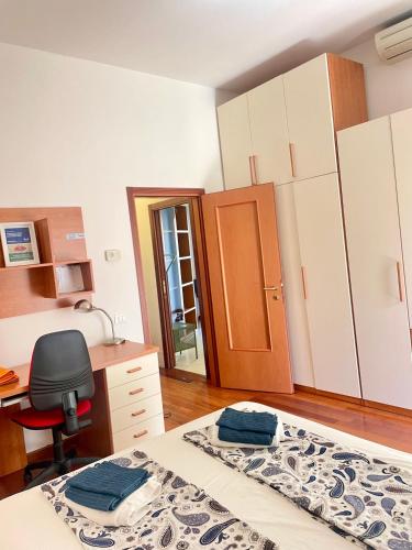 Ένα ή περισσότερα κρεβάτια σε δωμάτιο στο Trionfo your home in Trieste business and holiday stays