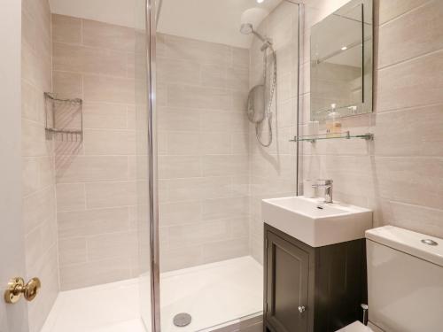 Vannituba majutusasutuses Manor Barn Cottage