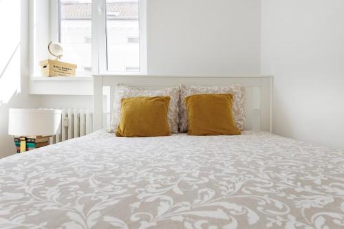 En eller flere senge i et værelse på Boutique Flat in Old Town