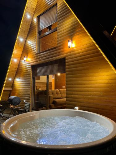a large jacuzzi tub in a room at Villa Route Rugove in Peje