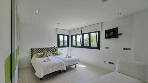 Ένα ή περισσότερα κρεβάτια σε δωμάτιο στο Vivienda Vacacional La Talima