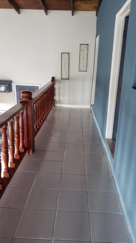a hallway with a staircase and a tile floor at Le Vie in Becke Moui