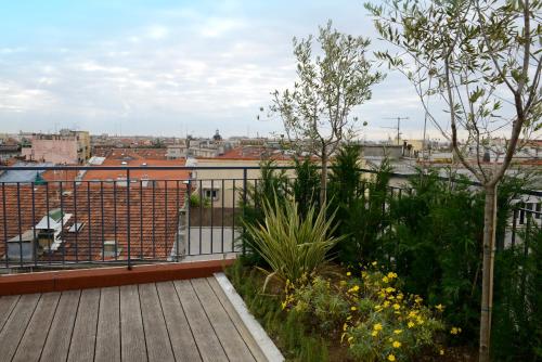 a balcony with a view of a city at Hôtel & Appartements Monsigny in Nice