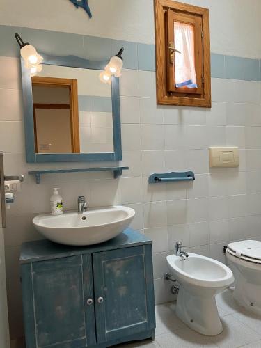 Un baño de Porto Coda Cavallo Salina Bamba
