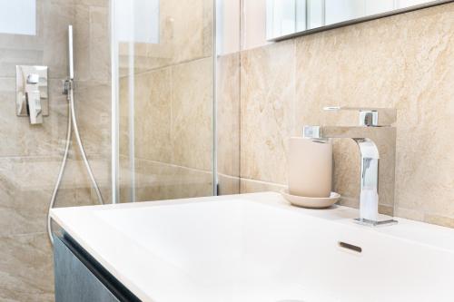 a bathroom with a sink and a shower at Casa Eolo Mare e Relax in Lido di Jesolo