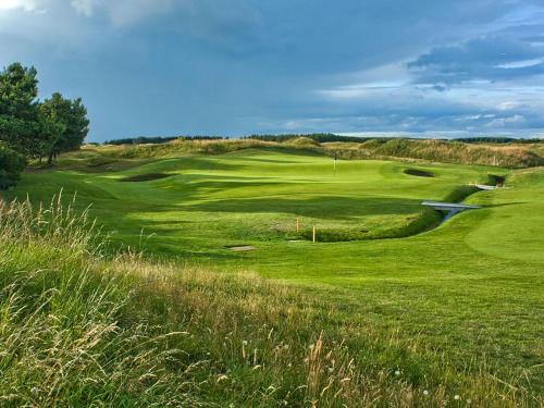a view of a golf course with a green at The Gailes Hotel & Spa in Irvine