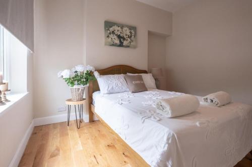 Ένα ή περισσότερα κρεβάτια σε δωμάτιο στο Rental unit in Uplands, Swansea