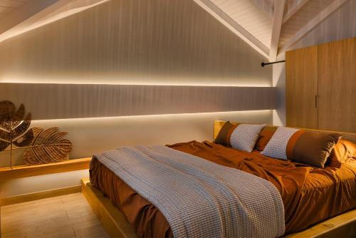 a bedroom with a bed in a room at Braunis Horio Villas in Asos