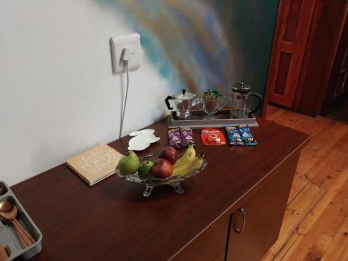 a counter with a bowl of fruit on it at De La Grace in Potchefstroom